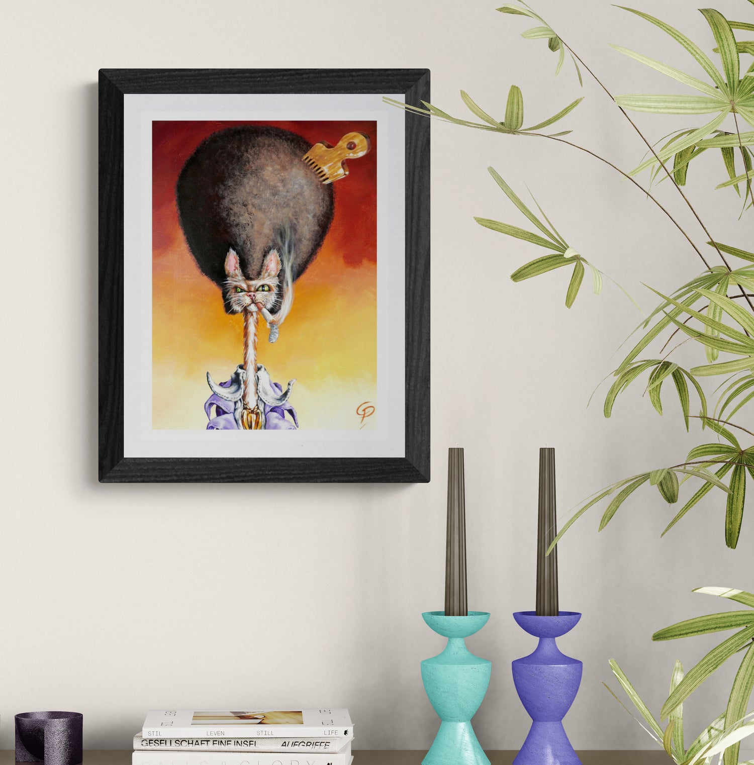 Framed artwork of a cat and mouse on a wall with decorative vases and books below.