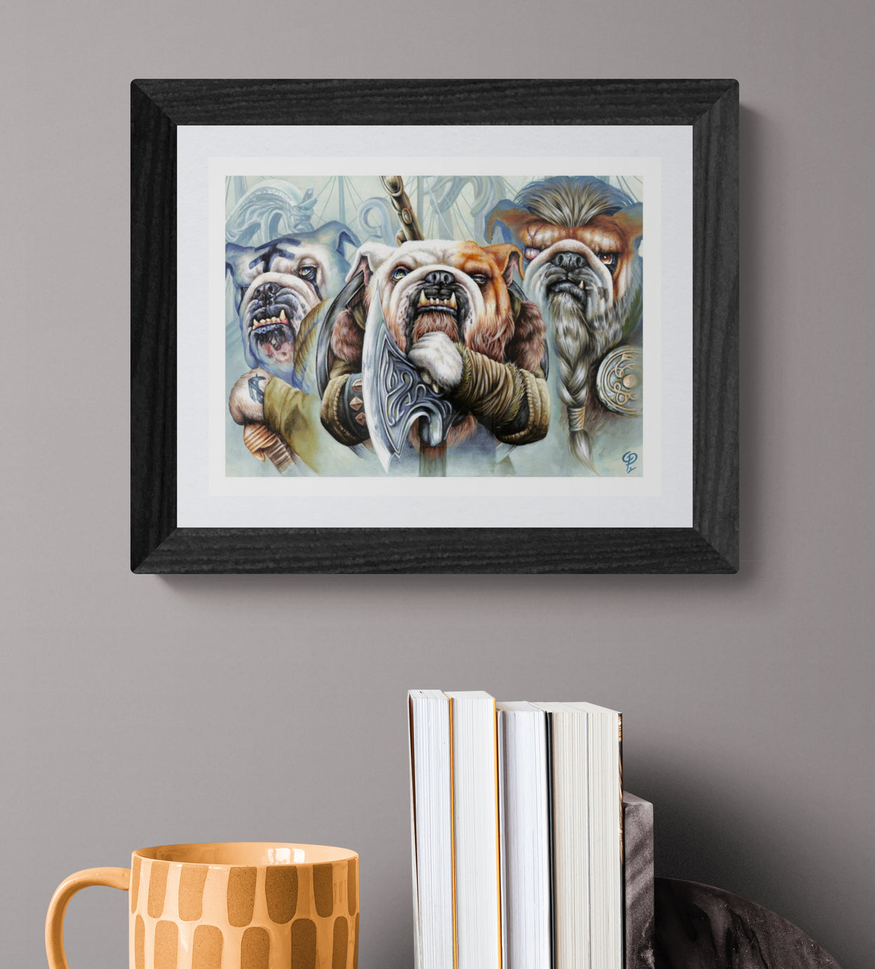 Framed artwork of viking bulldogs with armor on a gray wall above books and a mug.